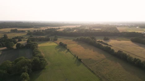 aerial view of farmland and countryside at sunset