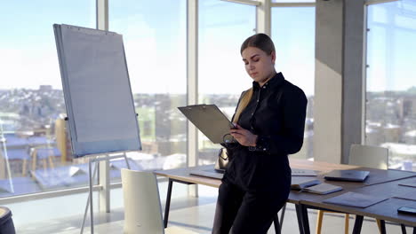 modern business woman in office. portrait of young woman in busy modern workplace