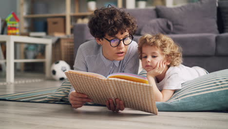mother and son reading a book together