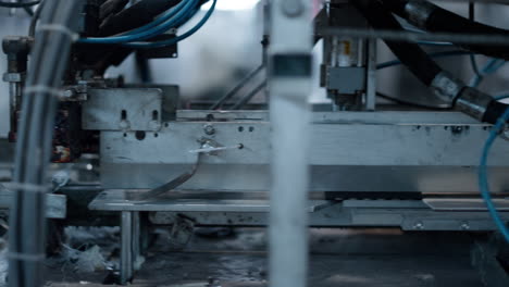 Closeup cardboard packing automat working automatically at manufacture