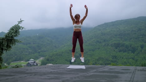 woman doing plank exercise in nature