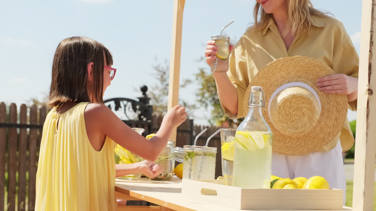 Girl Selling Lemonade On Hot Summer Day