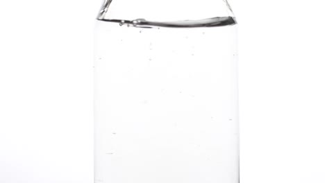 clear water throughing coins in water cosing air bubbles