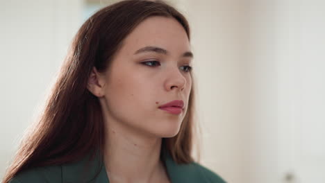 indifferent woman with emotional burnout at home closeup. frustrated lady handles with trauma symptoms staying in apartment. care of mental health