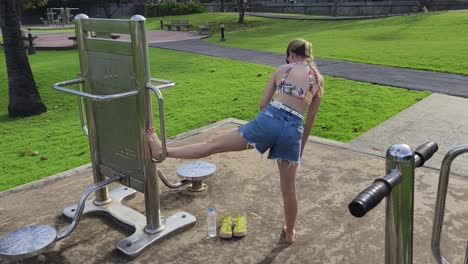 woman stretching in a park