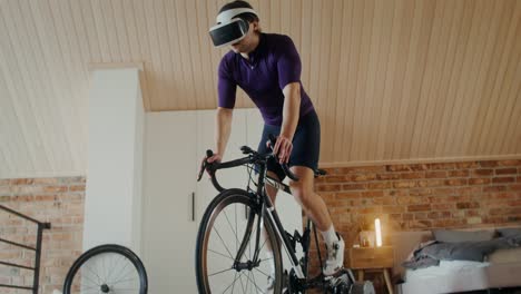 man using vr headset while cycling indoors