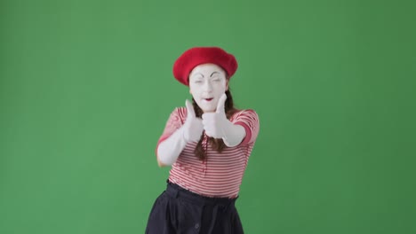 excited mime artist giving thumbs up gesture