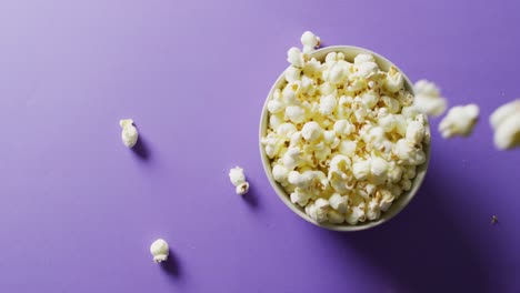 video of close up of popcorn on purple background