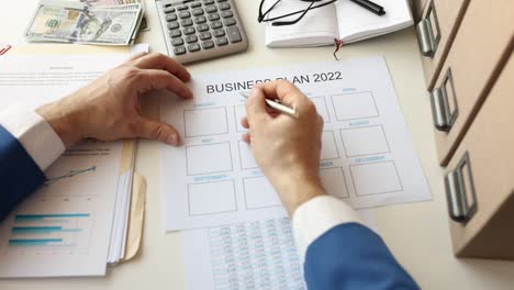 businessman draws up annual business plan for 2022 4k movie