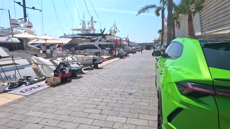 green lamborghini near yachts in monte carlo