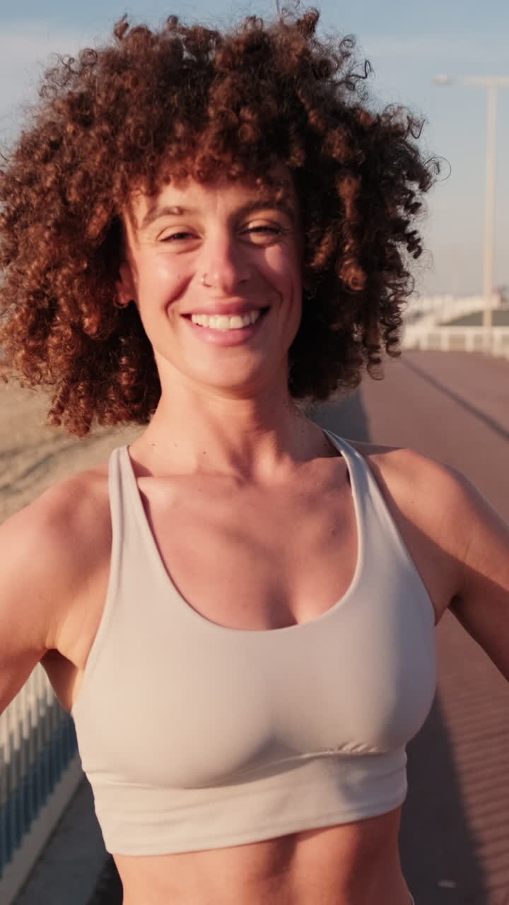 Happy Woman in Sportswear at Beach