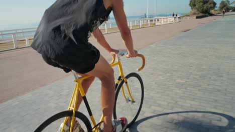 man cycling on a coastal path