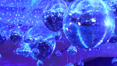 a group of disco balls spinning around