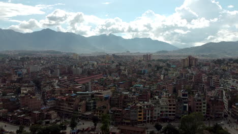 aerial rising shot of kathmandu city on a bright sunny day