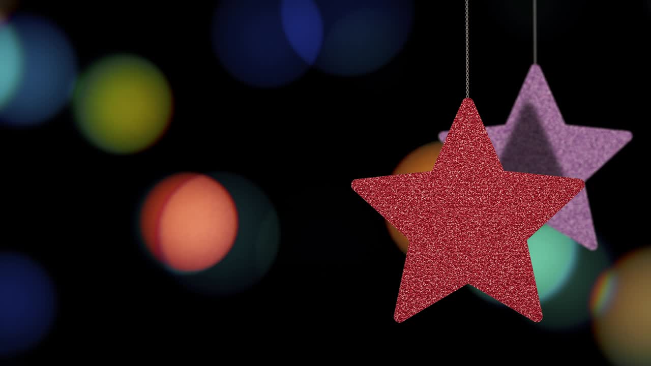 los adornos de las estrellas de navidad se mueven en el fondo de bokeh.