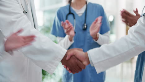 Doctors,-handshake-and-partnership-in-medical