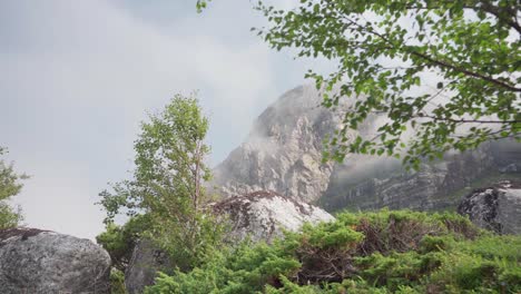 Scenic-View-Of-Rocky-Mountains-Surrounded-By-Misty-Clouds-In-Donnamannen,-Nordland-Norway