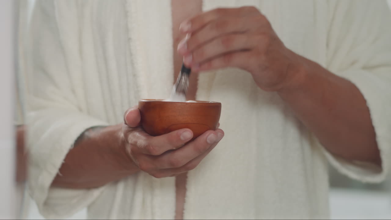 Gen Z Man Mixing and then Applying Shaving Cream on Face