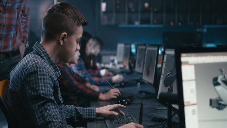 teenagers learning 3d design in a computer lab