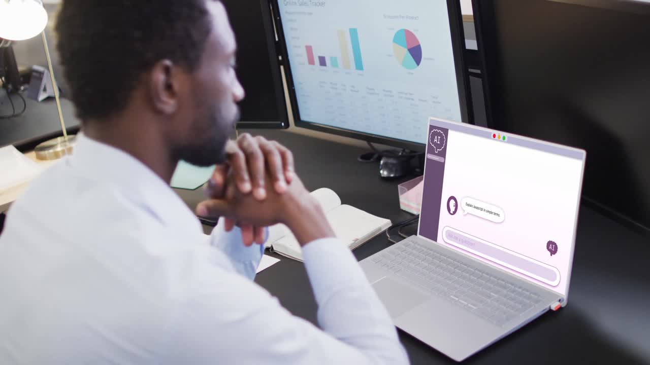 Composition of african american businessman using laptop with ai chat on screen