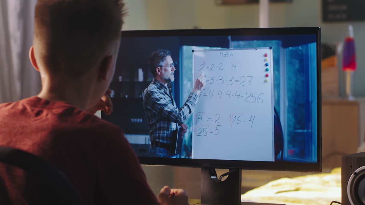 Indian Asian teenage girl attending online class at home, preparing for exams with technology