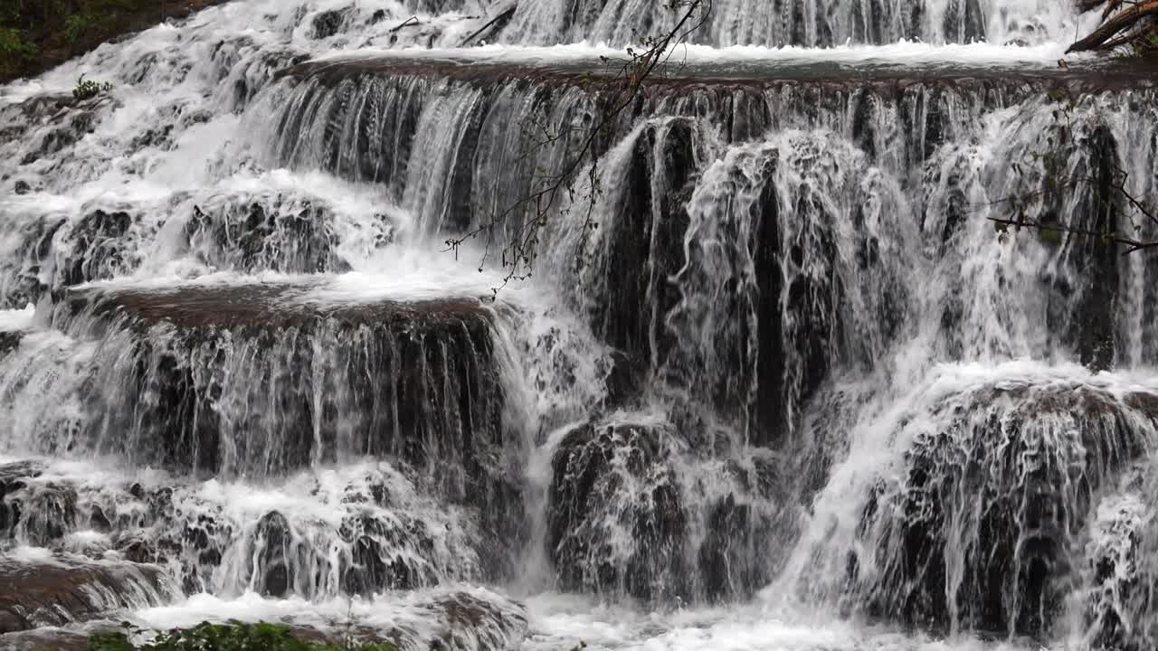 Slow motion video of terraced forest waterfall Dokuzak in Strandzha Mountain near Burgas, Bulgaria