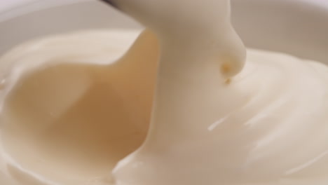 mayonnaise in a bowl with spoon