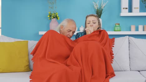 couple chilling at home. heating problem.