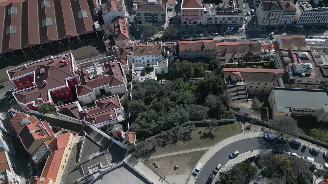 Sunny aerial view captures Bridge 25 April statue, and busy traffic crossing the bridge