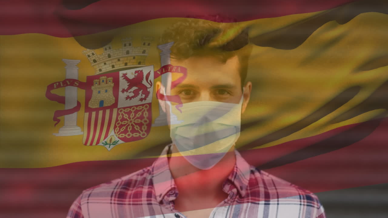 animación de la bandera de españa ondeando sobre un hombre que usa una máscara facial durante la pandemia de covid-19