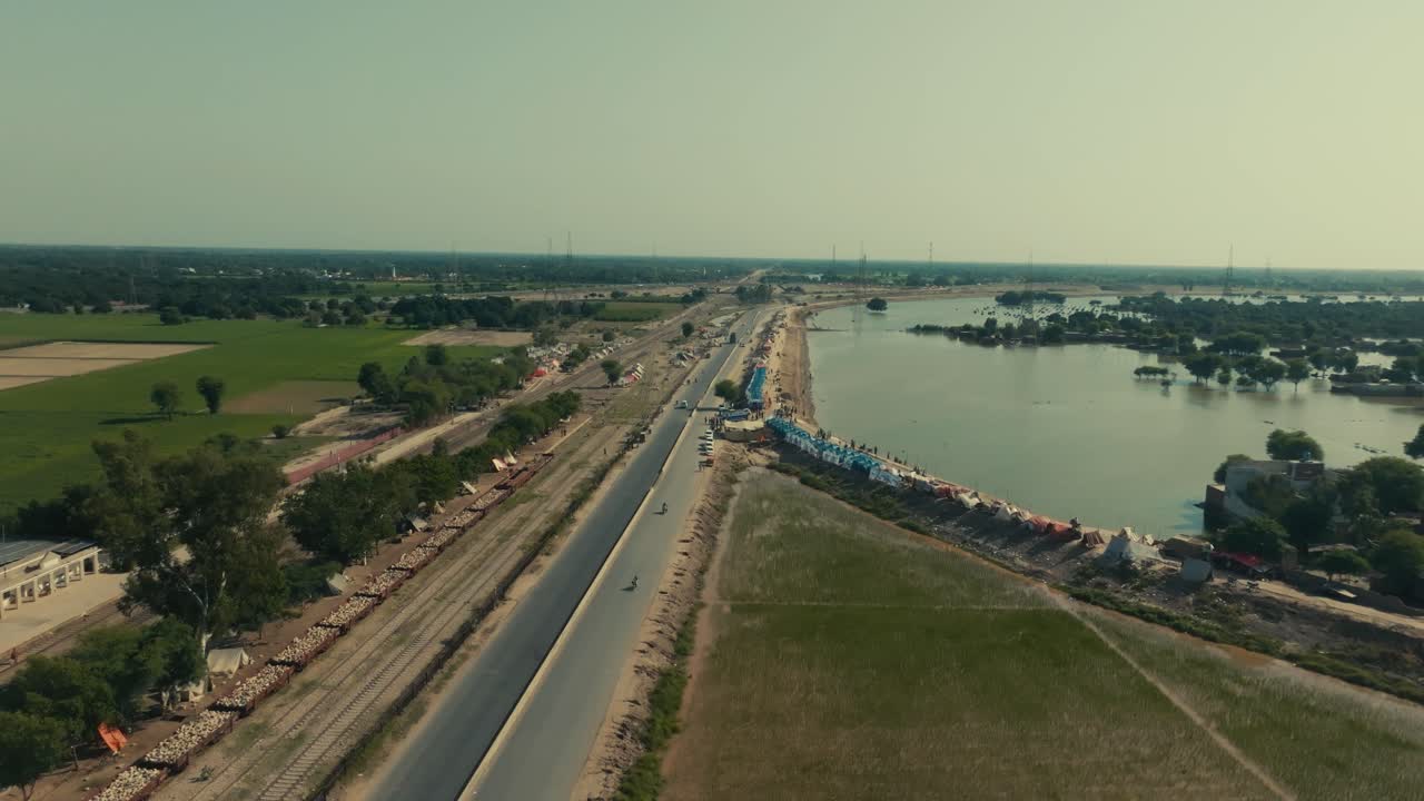 Aerial view of flooded highway and relief tents in Jalalpur Pirwala Punjab Pakistan
