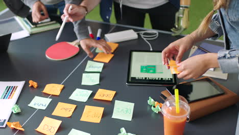 Team,-hands-and-planning-with-sticky-notes