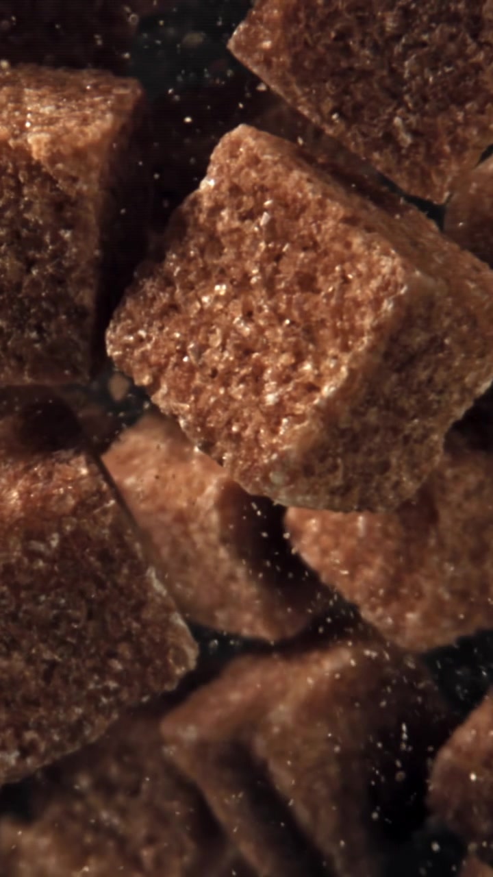Close-Up Macro Shot of Brown Sugar Cubes with Sparkling Particles