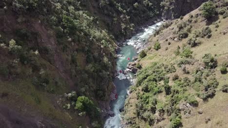 tourists on a white water river rafting adventure in new zealand - aerial