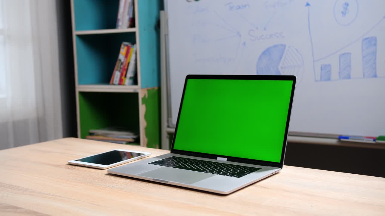 Green Screen Laptop With Business Plan At The Background