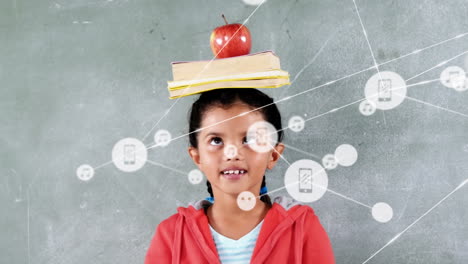 animation of network of icons over biracial girl balancing books and apple on her head at school