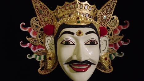 Traditional-Topeng-Mask,-Wood-Carving-of-Asian-Culture,-Bali-Indonesia,-Black-Background,-Closeup-Shot