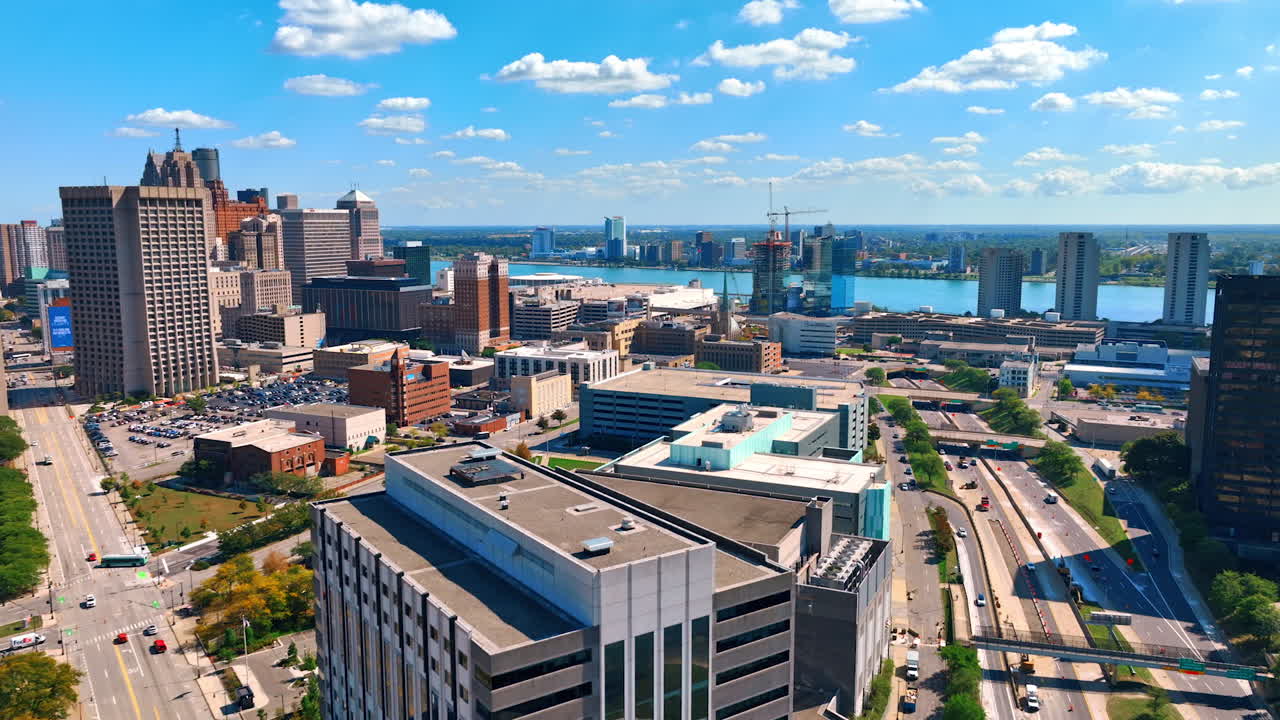Detroit, USA, 28 July 2025: Modern panorama of Detroit, Michigan, USA. Drone footage approaching the waterscape of Detroit River