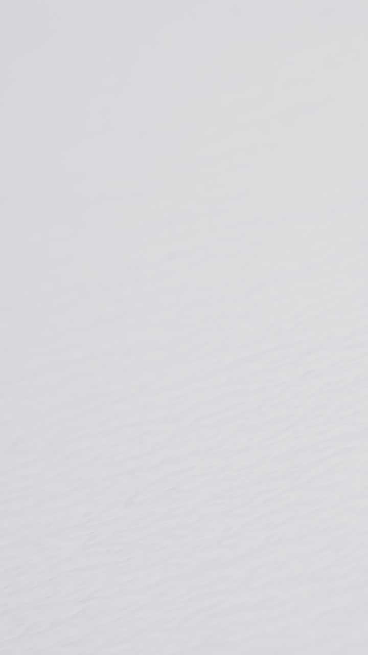 broken black plastic propeller of modern drone lies on clean white background extreme close view