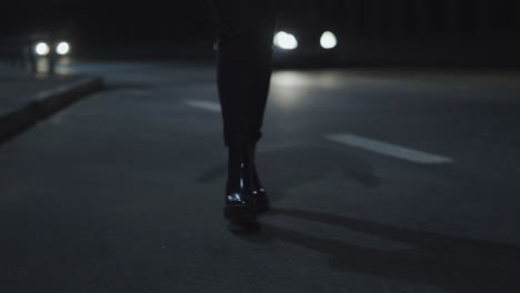 Girl-legs-going-road-on-driving-tunnel-at-late-night-city-street.