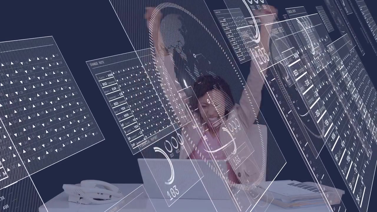 Working woman wearing blazer and pink blouse at desk with laptop, gesturing amid holographic panels
