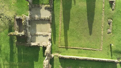 Basingwerk-abbey-landmark-medieval-abandoned-Welsh-ruins-Aerial-view-birdseye-rising-shot