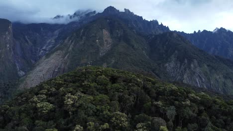 cinematic dramatic close drone shot of mount kinabalu at maragang hill sabah malaysia daylight