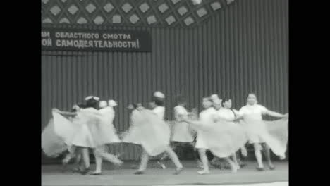 soviet children performing dance routine on a stage. circa ussr 1970: soviet children performing dance routine on a stage