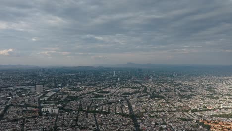 drone dolly in shot of guadalajara, jalisco city at a cloudy winter day