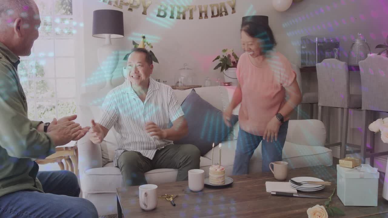 Woman entering carrying cake, birthday man clapping, hugging, shaking hand under marketing banner