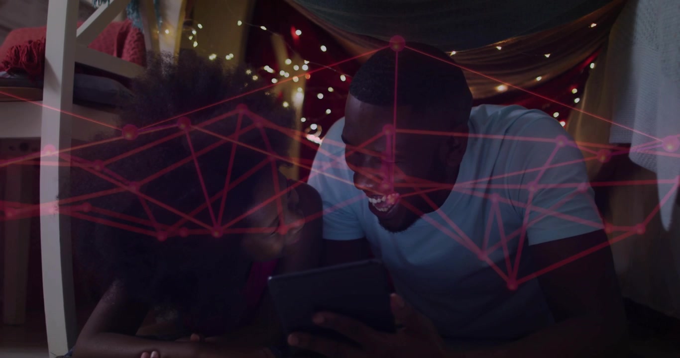 Vertical video: Adult male tapping tablet, girl leaning in as red net overlay sparking tech bonding