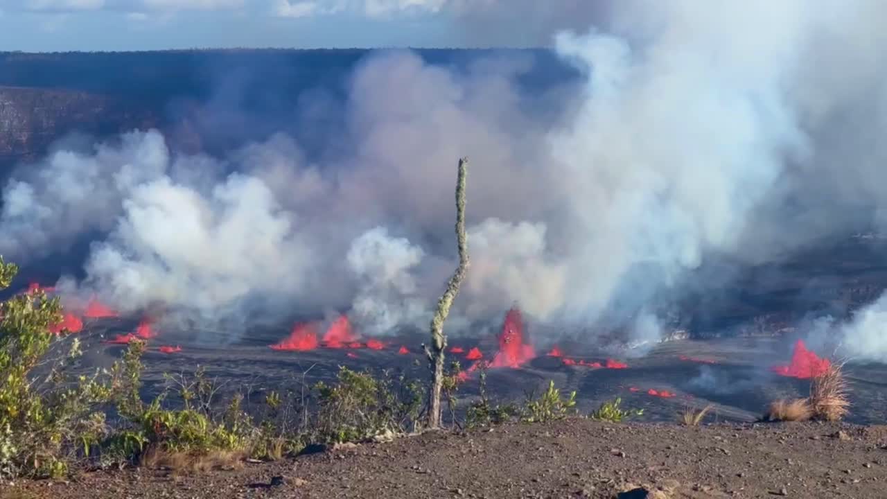 Cinematic wide panning shot of the lava fountains spewing from Kilauea a few hours after it began erupting in September 2023 at Hawai'i Volcanoes National Park