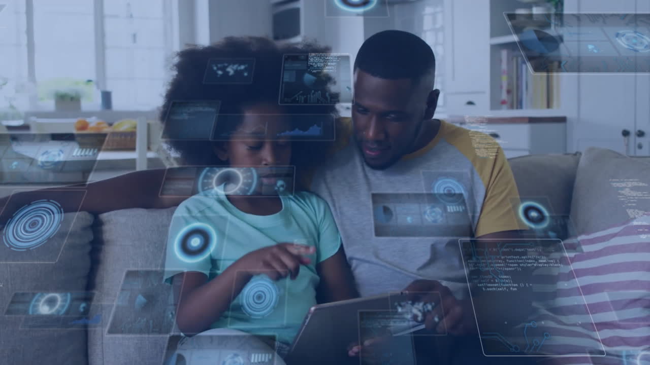 Animation of data over happy african american father and daughter using tablet relaxing at home