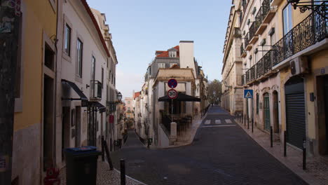 typical alley in the old town in alfama district, lisbon, portugal